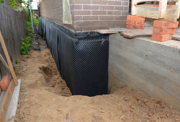 SJ Waterproofing Pros technician performing targeted Waterproofing assessment in Scottsburg, IN